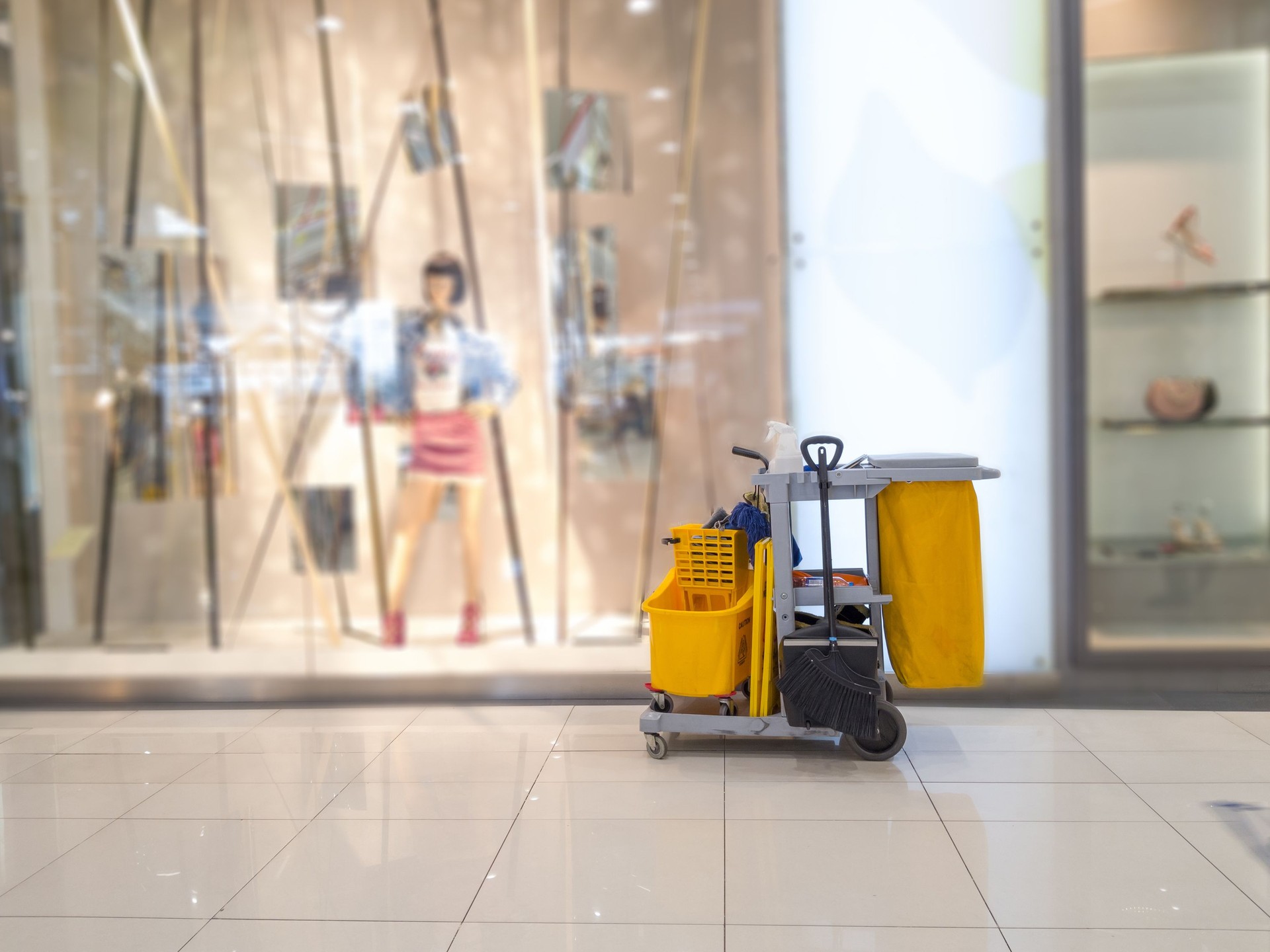 Cleaning tools cart wait for cleaner.Bucket and set of cleaning equipment in the Department store. janitor service janitorial for your place. Concept of service, worker and equipment for cleaner